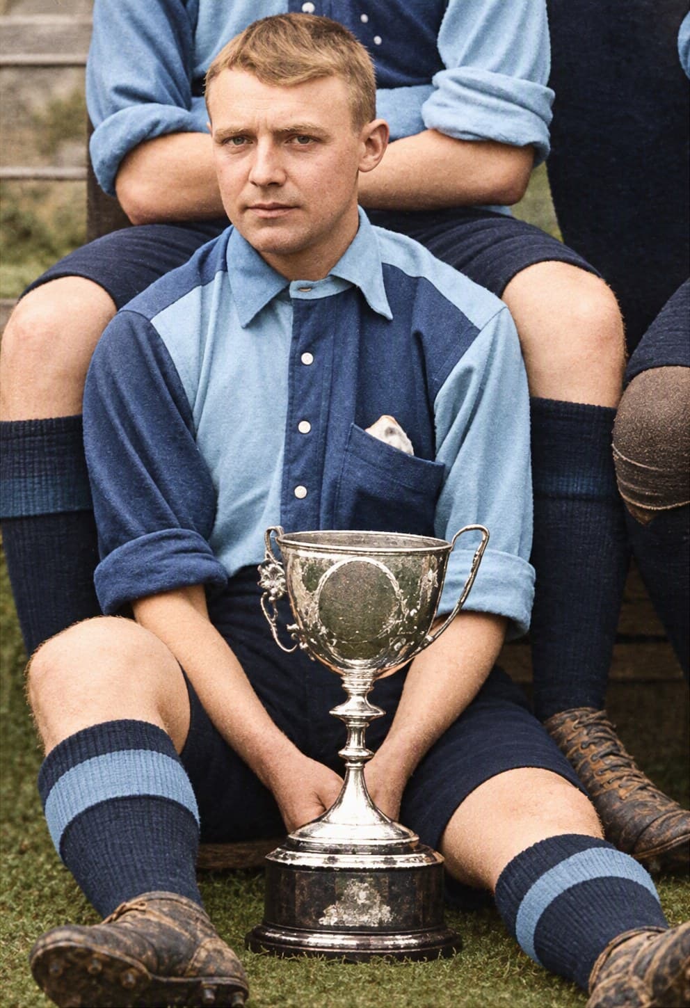 William Buchanan in Wycombe's light and dark blue, seated with the Berks & Bucks Senior Cup (colourised photograph)